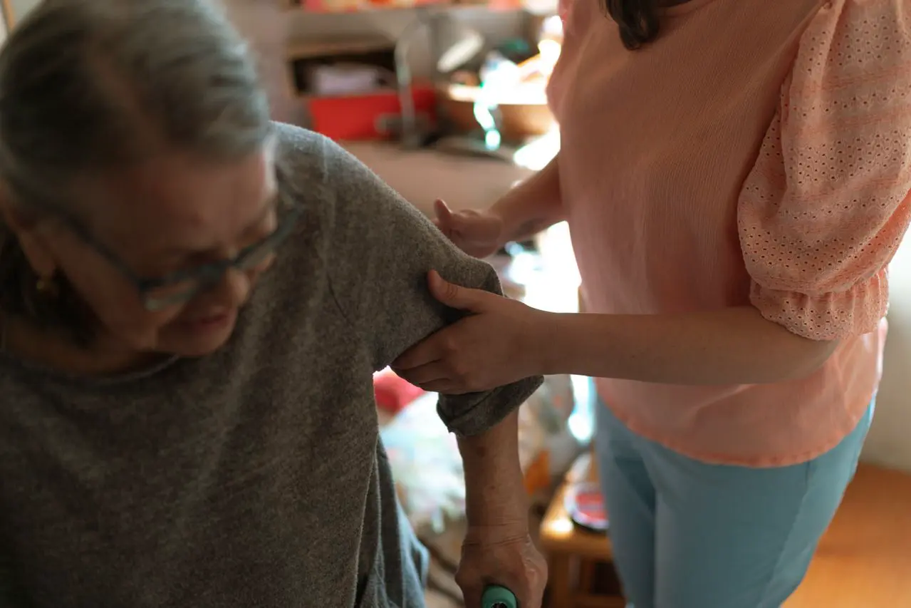 Person receiving respectful mobility support at home