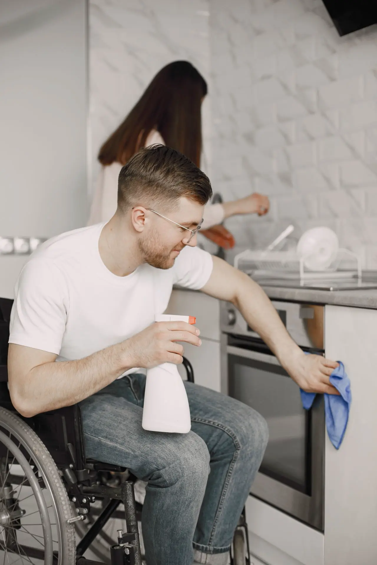 Wheelchair user receiving support in an accessible home setting