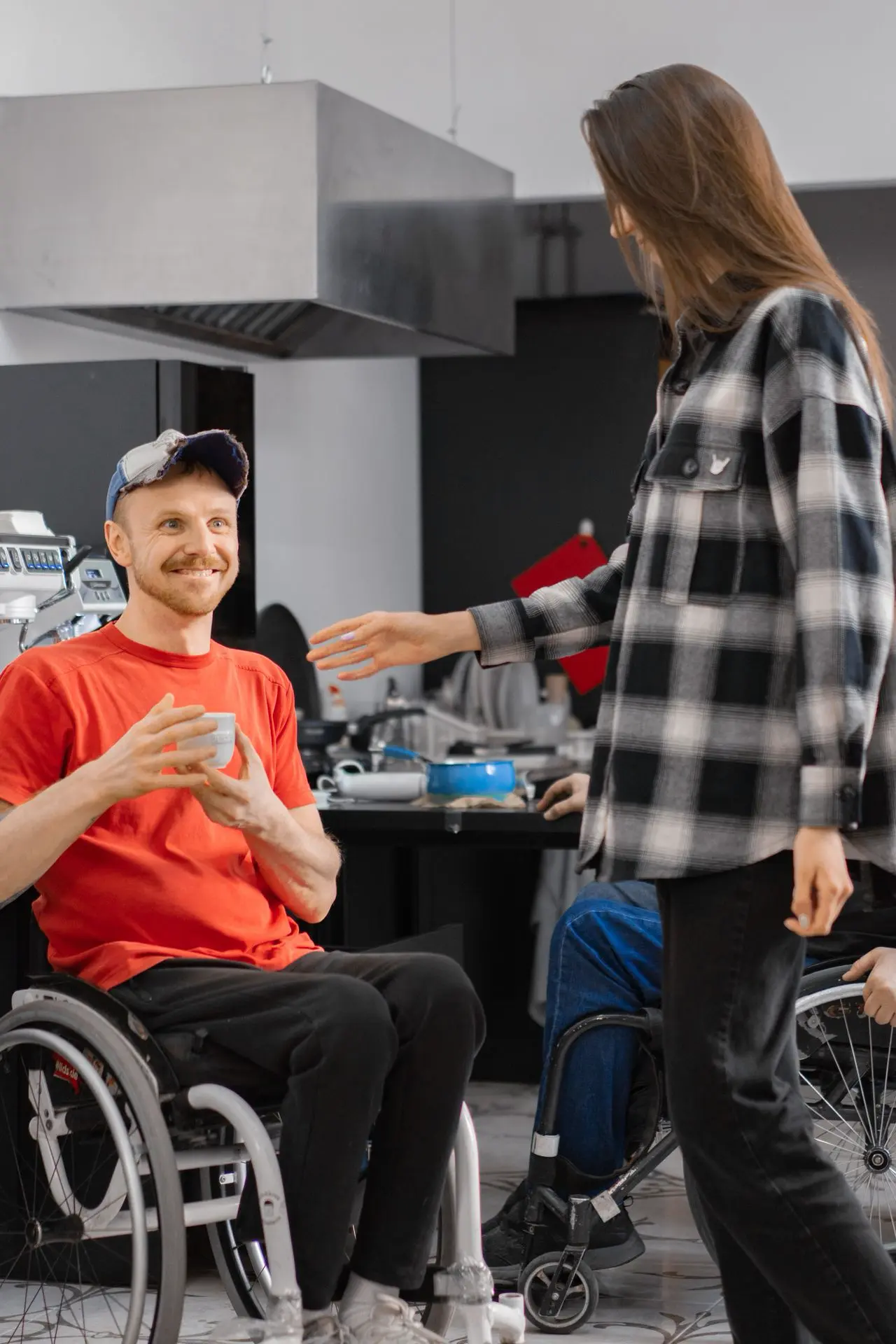 Wheelchair user participating in work with support